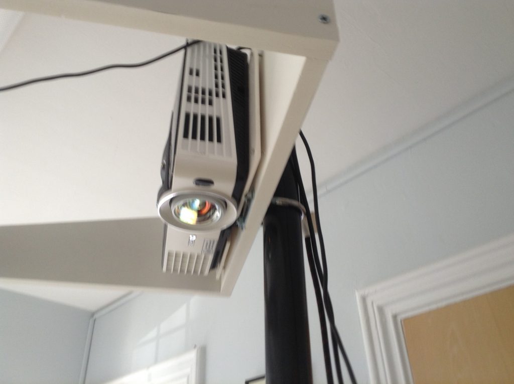 A close up photo of a projector pointing downwards