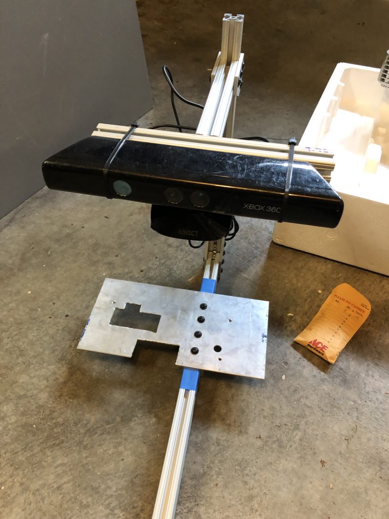 The original projector mounting plate connected to the projector pole
